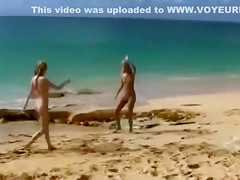 Nude beach foreplay and lesbian licking with brunettes
