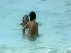 Nude beach foreplay and lesbian licking with brunettes