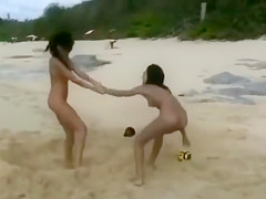 Nude beach foreplay and lesbian licking with brunettes
