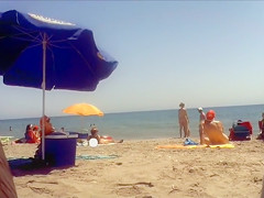 Ravishing woman strips out of a tight red dress in the sun