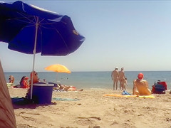 Ravishing woman strips out of a tight red dress in the sun