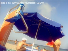 Ravishing woman strips out of a tight red dress in the sun