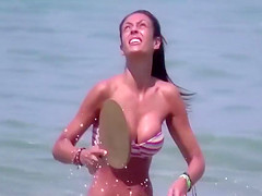 Brunette at the beach filmed as she provides pure beauty