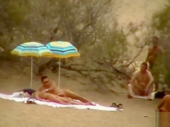 Hubby playing with her pussy in beach voyeur view