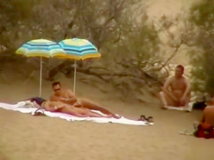 Hubby playing with her pussy in beach voyeur view