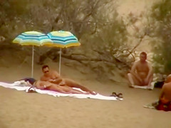Hubby playing with her pussy in beach voyeur view