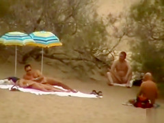 Hubby playing with her pussy in beach voyeur view