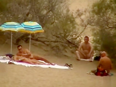 Hubby playing with her pussy in beach voyeur view