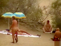 Hubby playing with her pussy in beach voyeur view