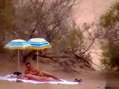 Hubby playing with her pussy in beach voyeur view