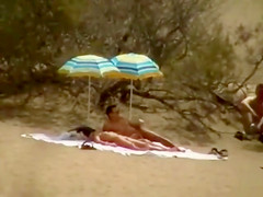 Hubby playing with her pussy in beach voyeur view