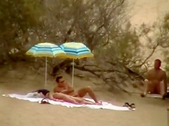 Hubby playing with her pussy in beach voyeur view