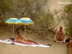 Hubby playing with her pussy in beach voyeur view