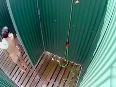 Skinny brunette filly takes a quick shower in the beach cabin