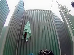 Skinny brunette filly takes a quick shower in the beach cabin