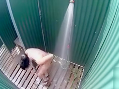 Skinny brunette filly takes a quick shower in the beach cabin