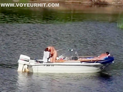 Nudist couple has fun in the middle of a beautiful lake
