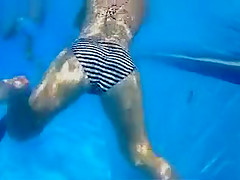 Playgirl tugs on a friend's dick in the pool