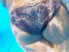 Playgirl tugs on a friend's dick in the pool