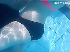 Playgirl tugs on a friend's dick in the pool