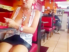 Old woman showing off her big chest