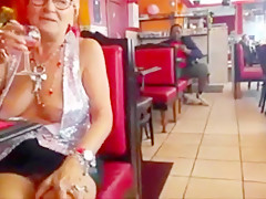 Old woman showing off her big chest