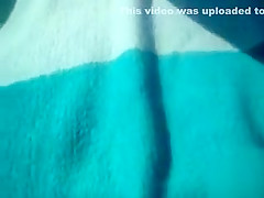 Sweet bimbo sunbathes with her shaved pussy lips out in the open