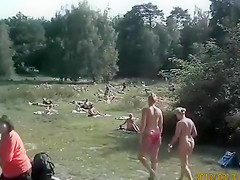 Sunny day at the nudist camp by the river