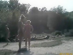 Sunny day at the nudist camp by the river