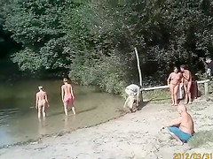 Sunny day at the nudist camp by the river