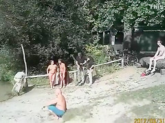 Sunny day at the nudist camp by the river