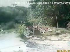 Sunny day at the nudist camp by the river