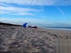 Horny daddy pisses and jerks off his penis on a black babe at the beach