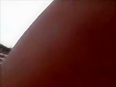 Horny daddy pisses and jerks off his penis on a black babe at the beach