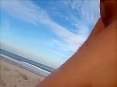 Horny daddy pisses and jerks off his penis on a black babe at the beach