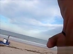 Horny daddy pisses and jerks off his penis on a black babe at the beach