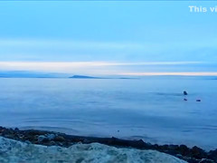 Naked woman greets the beauty of the sea