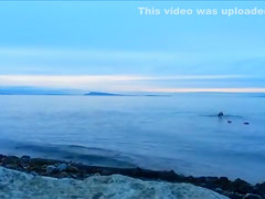 Naked woman greets the beauty of the sea