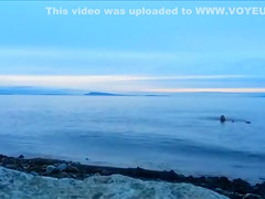 Naked woman greets the beauty of the sea