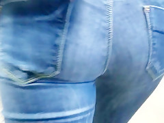 Girl with tight ass is walking down the street