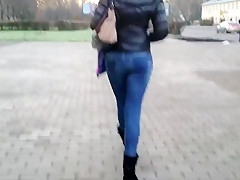 Girl with tight ass is walking down the street