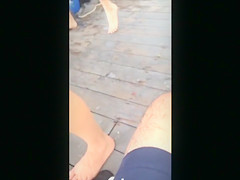 Blonde hussy walks around in a revealing bikini