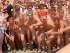 Lots of naked bodies at a nudist race
