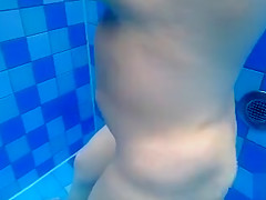Curvy naked body floats in the pool