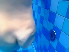 Curvy naked body floats in the pool