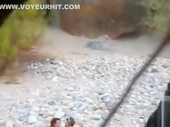 Slim brunette honey enjoys blowing a dick at the beach