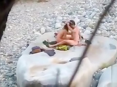 Slim brunette honey enjoys blowing a dick at the beach