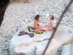 Slim brunette honey enjoys blowing a dick at the beach