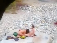 Slim brunette honey enjoys blowing a dick at the beach