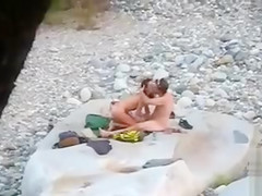 Slim brunette honey enjoys blowing a dick at the beach